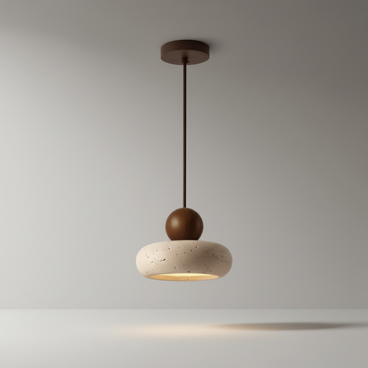 Studio shot of Mente pendant light with travertine shade and wood sphere accent
