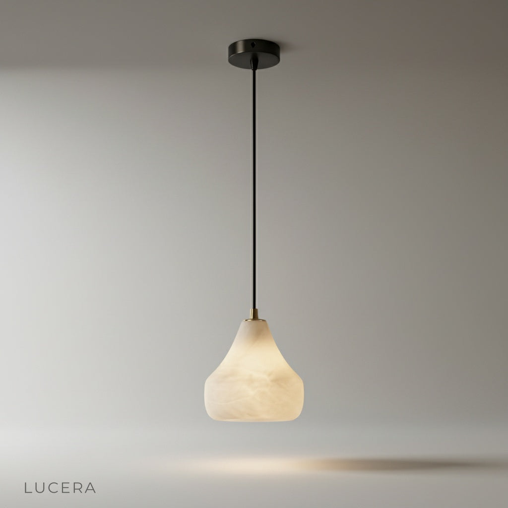 studio shot of ivory alabaster pendant light on clean white background