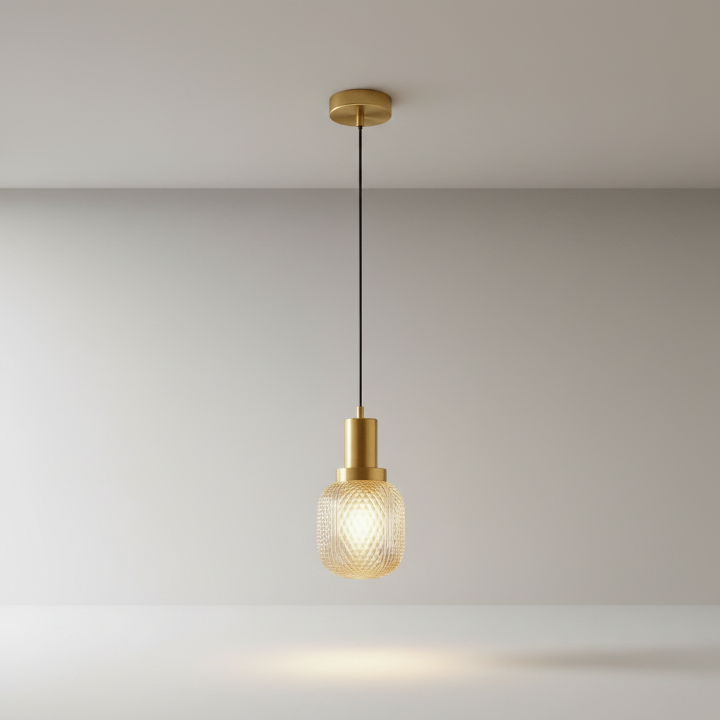 Silvia brass pendant light with diamond-cut glass shade on clean studio background