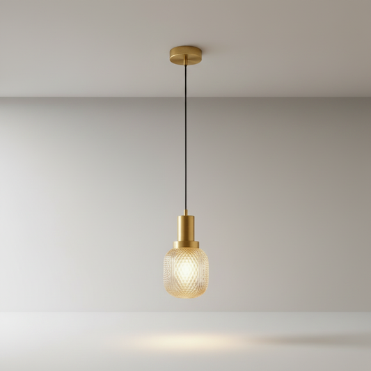 Silvia brass pendant light with diamond-cut glass shade on clean studio background