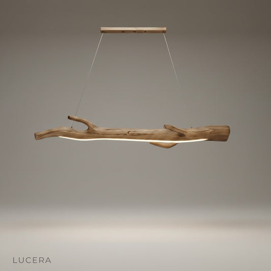 studio shot of Humoresque pendant light with intricate resin branch design against clean white background