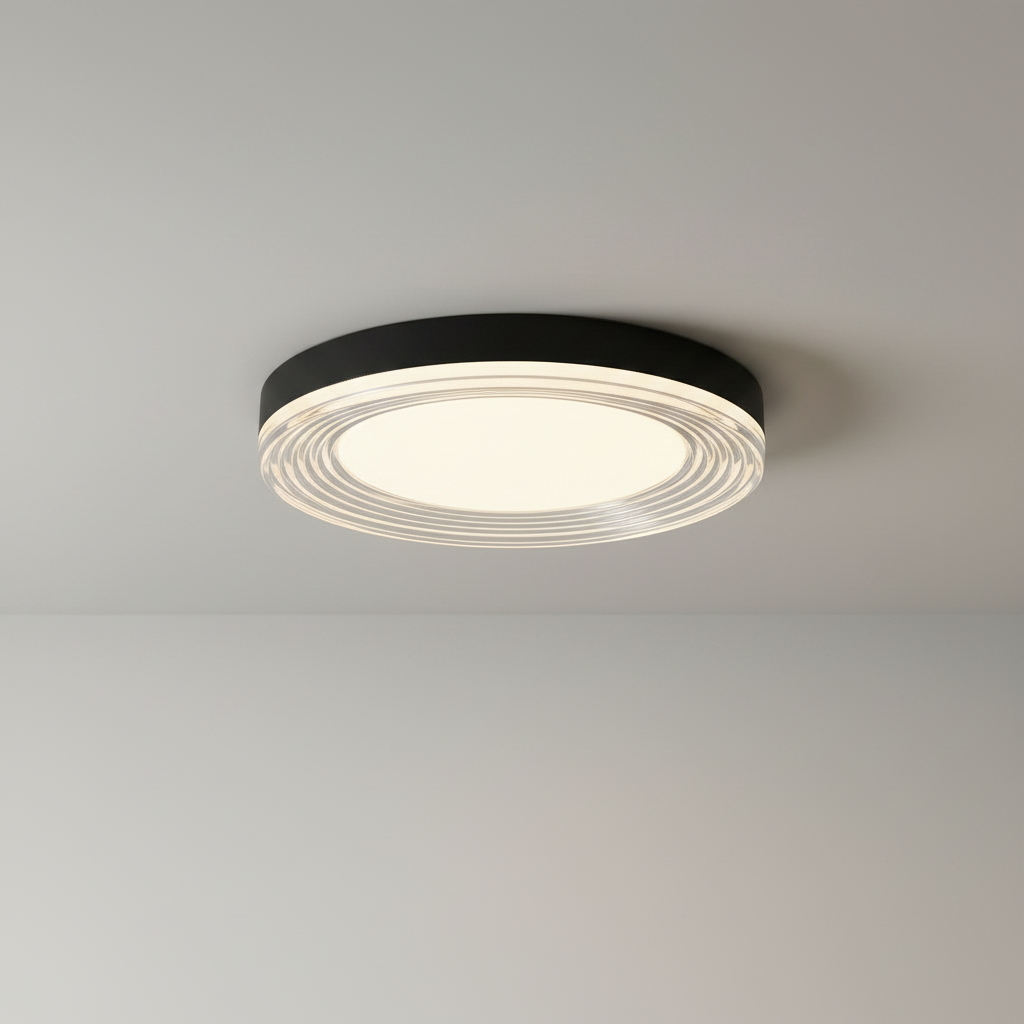 studio shot of round black ceiling light with layered acrylic rings front view
