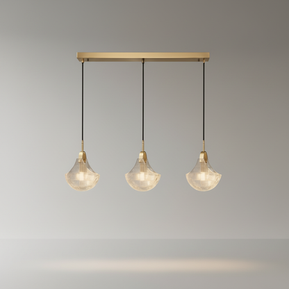 studio shot Leggero pendant light three sculptural glass covers brushed copper hardware