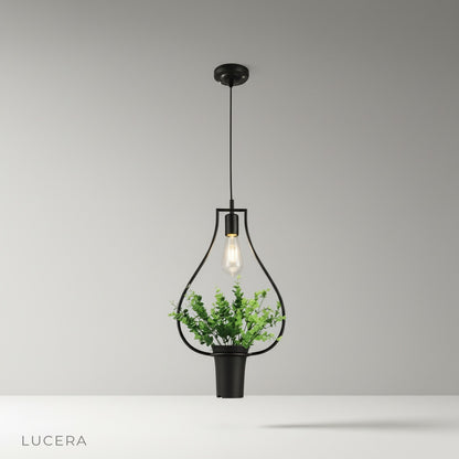 Studio shot of Keep Pendant Light with matte black metal shade and clear LED bulb