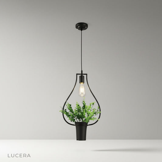 Studio shot of Keep Pendant Light with matte black metal shade and clear LED bulb
