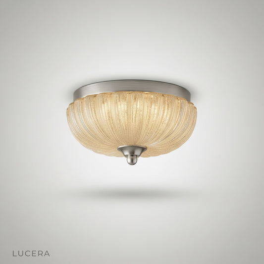 studio shot of Lucera ceiling light with clear glass shade and iron frame