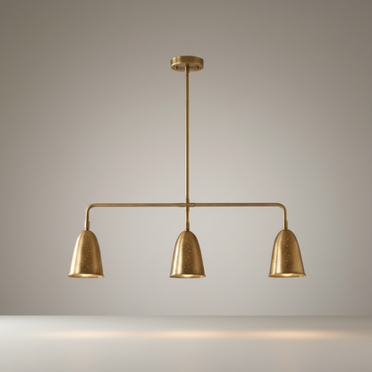 studio shot of whimsy linear chandelier with curved brass shades and perforated details