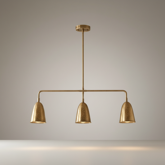 studio shot of whimsy linear chandelier with curved brass shades and perforated details