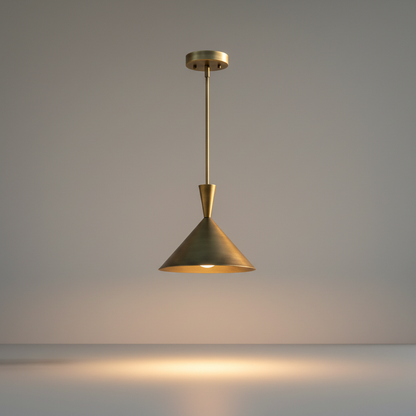 studio shot of a tapered brass sconce pendant light against a clean white background
