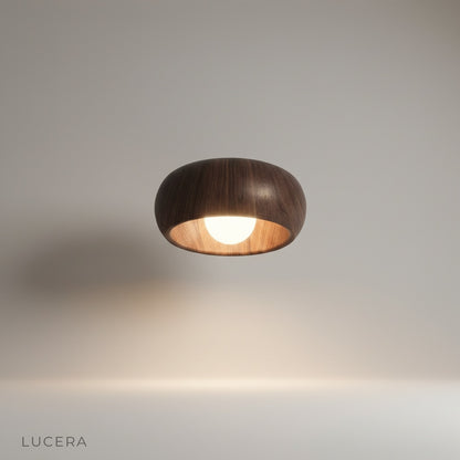 Studio shot of Keen ceiling light front view showing rounded wood and aluminum form