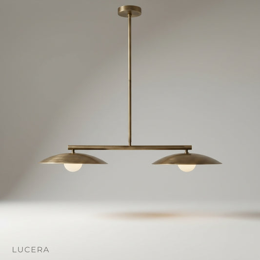 Studio shot of the Lucera disc pendant light with curved metal shades and spherical bulbs on clean white background