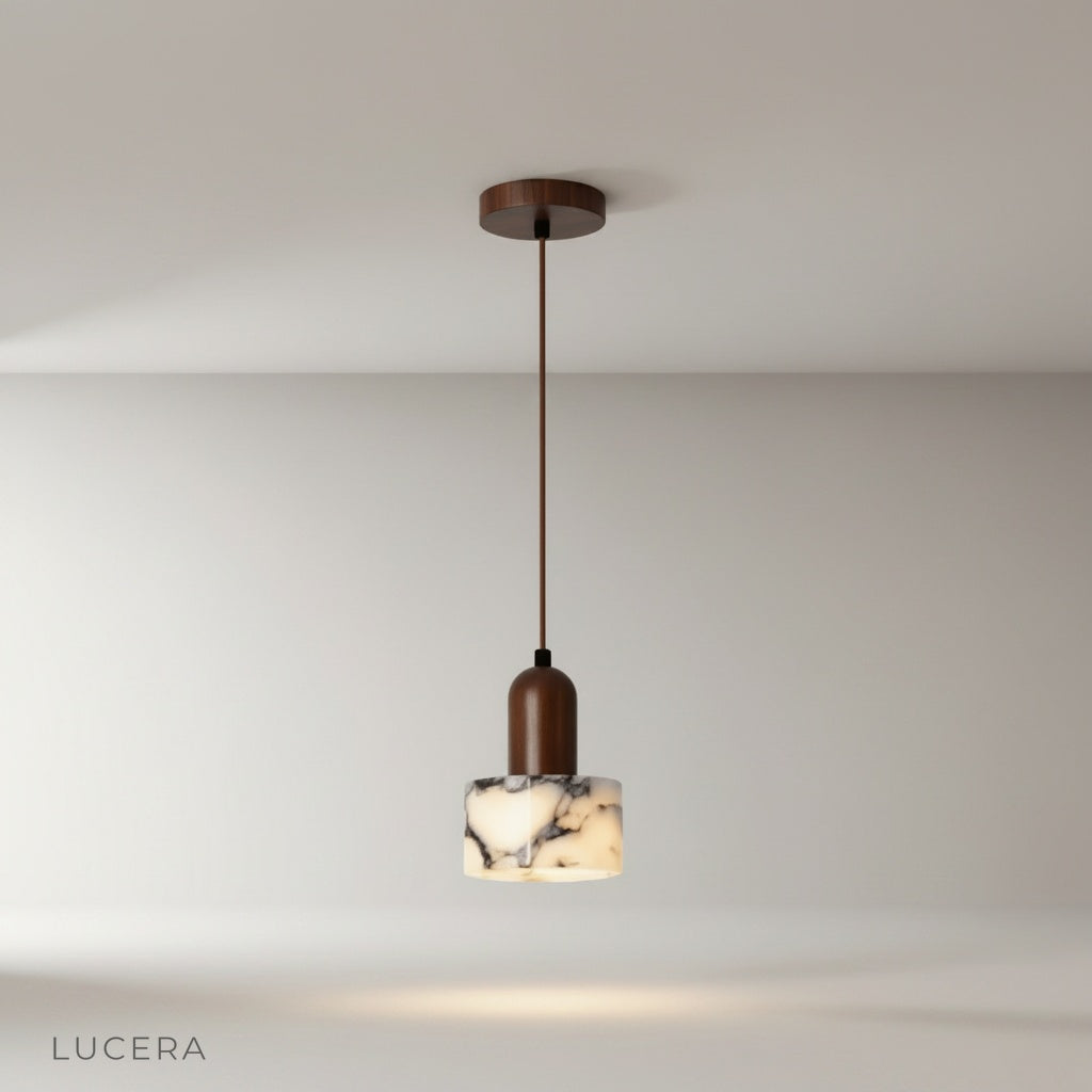 Minimalist Aglow pendant light with natural stone shade and wood accents on clean studio background