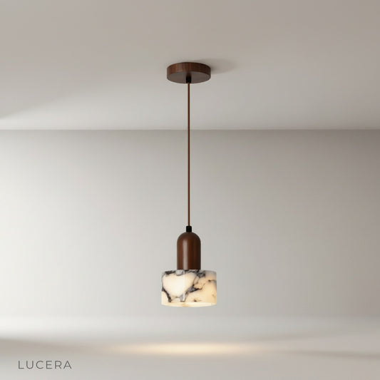 Minimalist Aglow pendant light with natural stone shade and wood accents on clean studio background