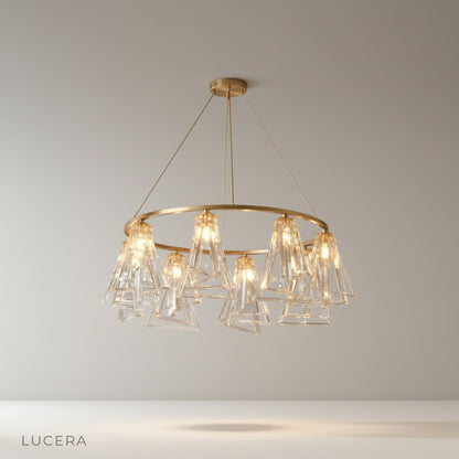 Studio shot of Bruma Chandelier with copper frame and clear crystal shades on clean white background