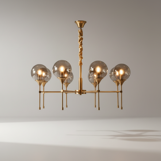 Erbaluce chandelier glowing in modern living room with warm metallic finish