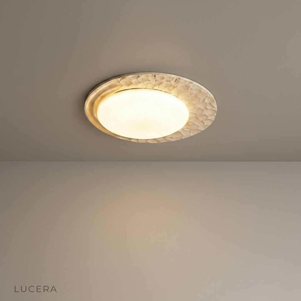 studio shot of obsess ceiling lamp with natural travertine base and marble shade