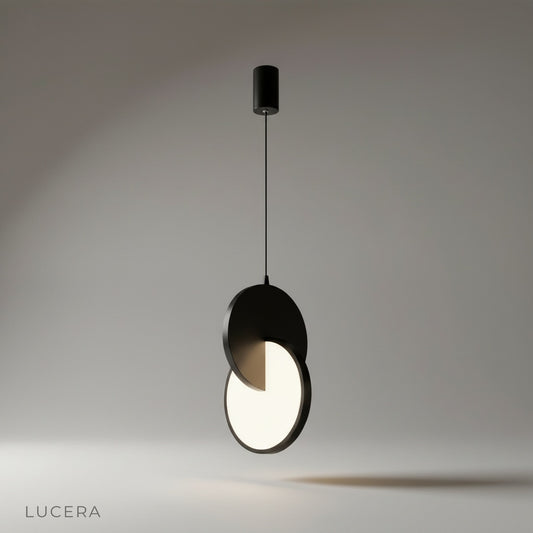 studio shot of Unveil pendant light front view showing dual layered aluminum and acrylic discs