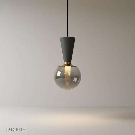 studio shot of Ivan pendant light with concrete cone and smoky glass orb