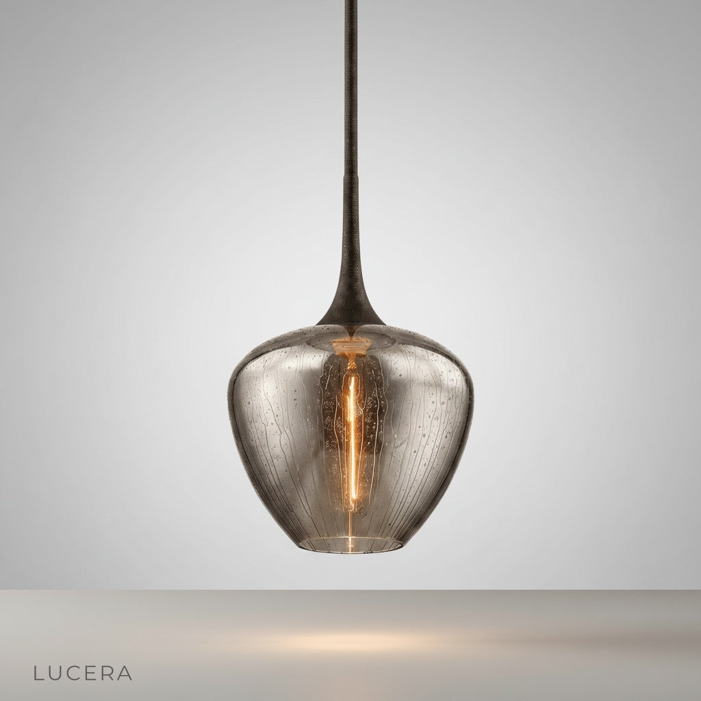 Studio shot of Livid Pendant Light with sleek iron frame and teardrop glass shade
