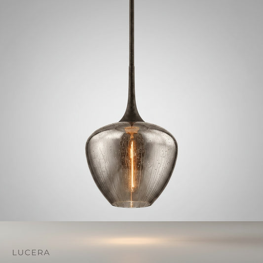 Studio shot of Livid Pendant Light with sleek iron frame and teardrop glass shade