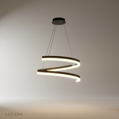 Studio shot of spiral iron and acrylic Hypnotize pendant light against white background