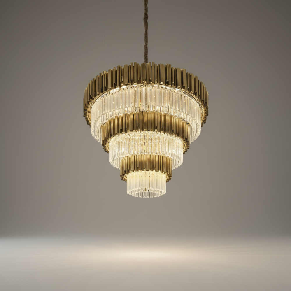 Studio shot of gold stainless steel chandelier with cascading clear crystals on clean white background