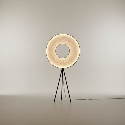 minimalist Kunzite floor lamp with metal frame and pleated fabric shade on white studio background