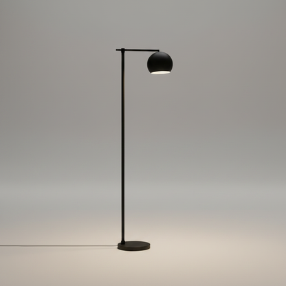 Minimalist black and gold floor lamp studio shot on clean white background