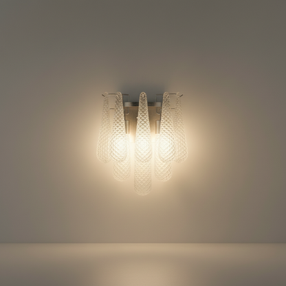 Studio shot of polished chrome wall sconce with handcrafted textured glass shade, front view on clean white background