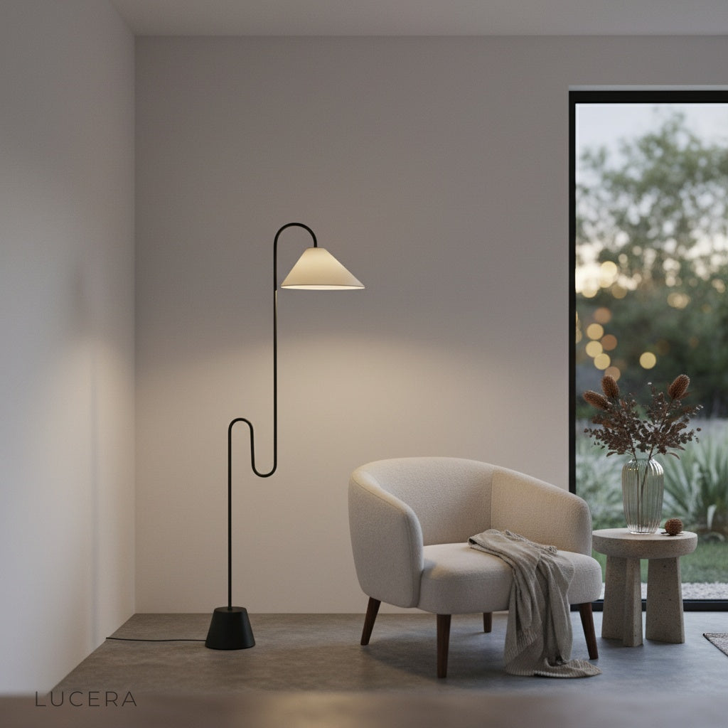 Plaudit Floor Lamp casting ambient glow in cozy evening reading nook