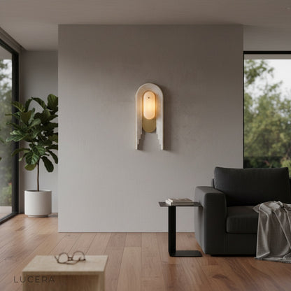 Fulgid wall lamp side profile showing warm diffused light in studio setting