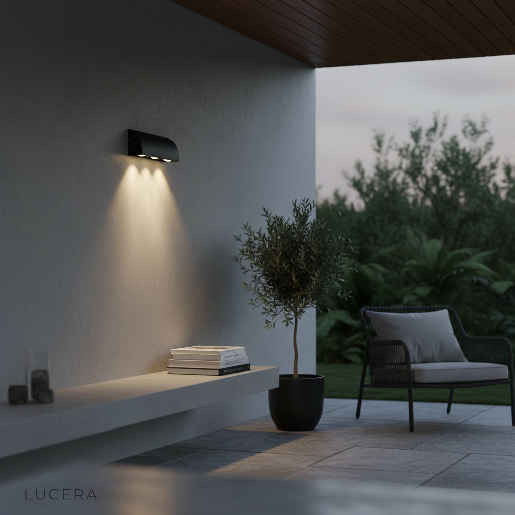close-up of matte gray aluminum finish and three-light design on wall sconce
