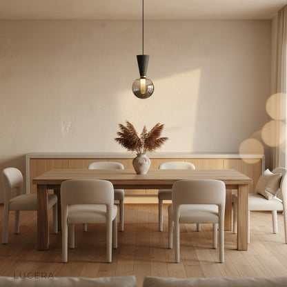 Ivan pendant light paired with wooden table and plants in bohemian style interior