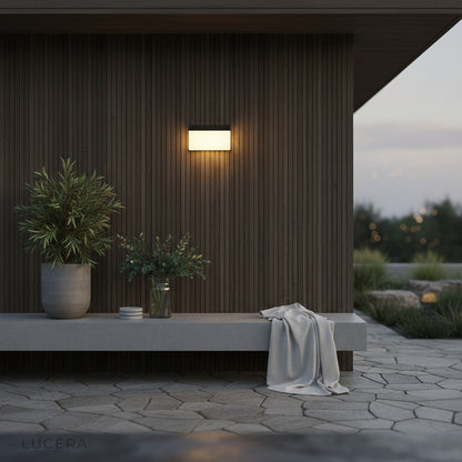 IP65 weatherproof outdoor light on brick wall with soft evening glow