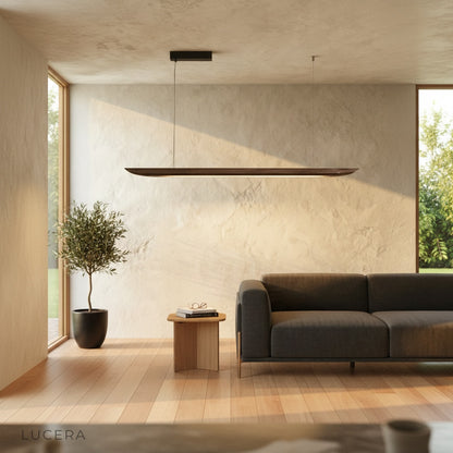 Fauvist pendant light above a kitchen island in a modern home, with soft shadows and natural wood accents