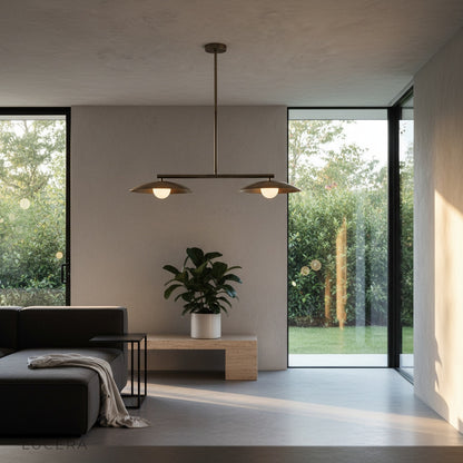 Quivering disc pendant light in a hallway with architectural ceiling and warm bulb glow