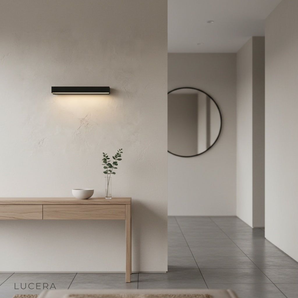 Goccia wall lamp in minimalist hallway, soft glow creating inviting atmosphere