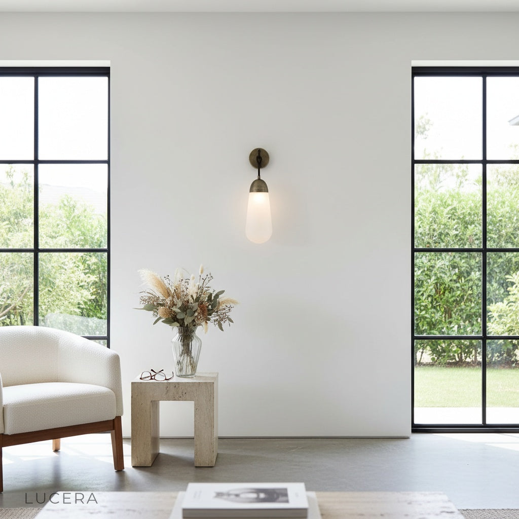 close-up of copper metal finish and frosted glass diffuser on wall sconce