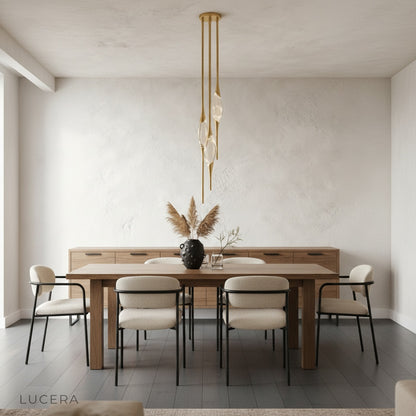 Indus pendant light in black finish casting soft diffused glow over minimalist bedroom