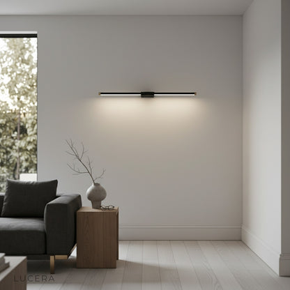 Tranquility Wall Lamp with brass accents in a stylish hotel-style bathroom interior