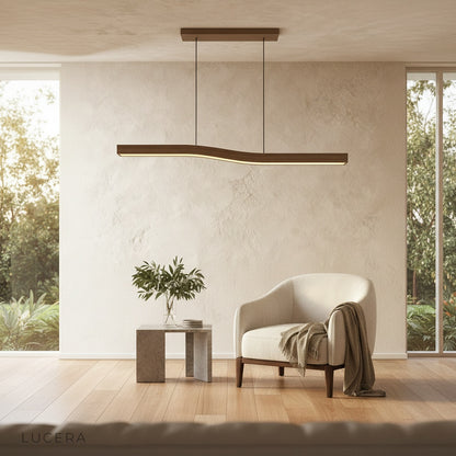 dimmable Tenebrous pendant light in cool white mode over a minimalist kitchen island