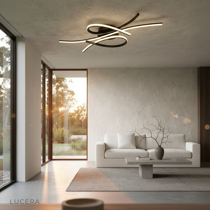 evening shot of sculptural light fixture creating dramatic shadows