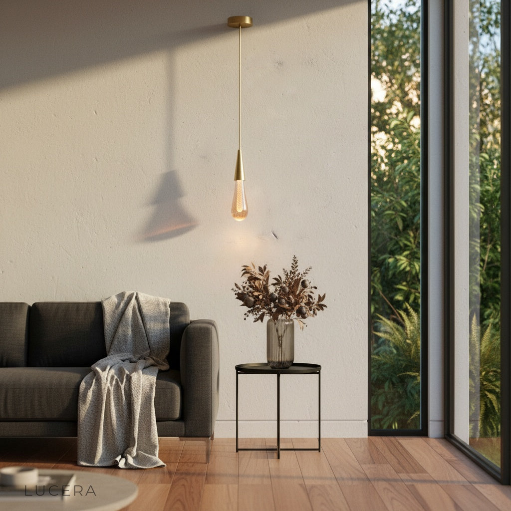 Beryl pendant light at night glowing warmly in dark living room corner