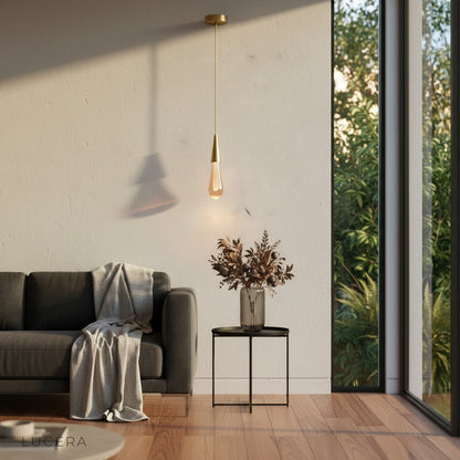 Beryl pendant light at night glowing warmly in dark living room corner