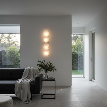 Esker wall lamp in a stylish lounge with copper and alabaster blending into decor