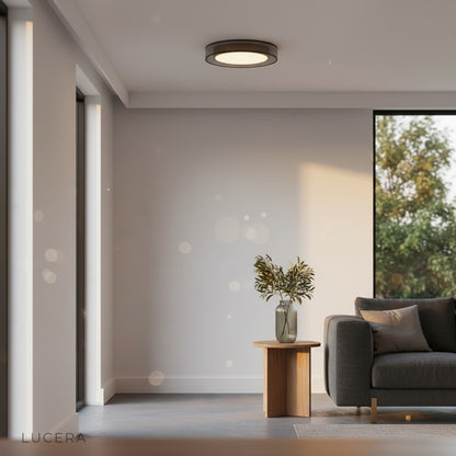 Alaric ceiling light illuminating a minimalist dining area with soft shadows