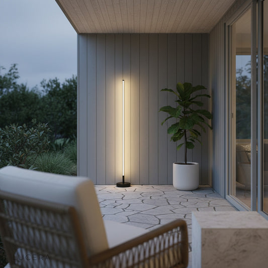 close-up studio view of the lamp's dimmable control and brushed metal finish