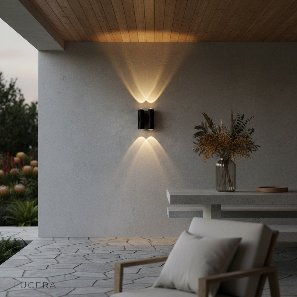 xylophone wall light casting upward and downward beams on brick wall