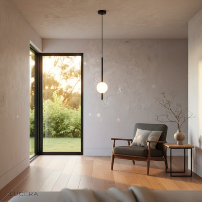 Nighttime mood shot of Fjord pendant glowing against dark interior