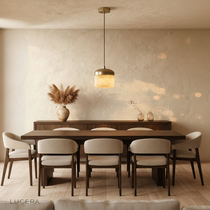 Energico Lucera pendant light glowing warmly in a minimalist hallway